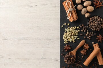 Different spices on wooden table, top view. Space for text