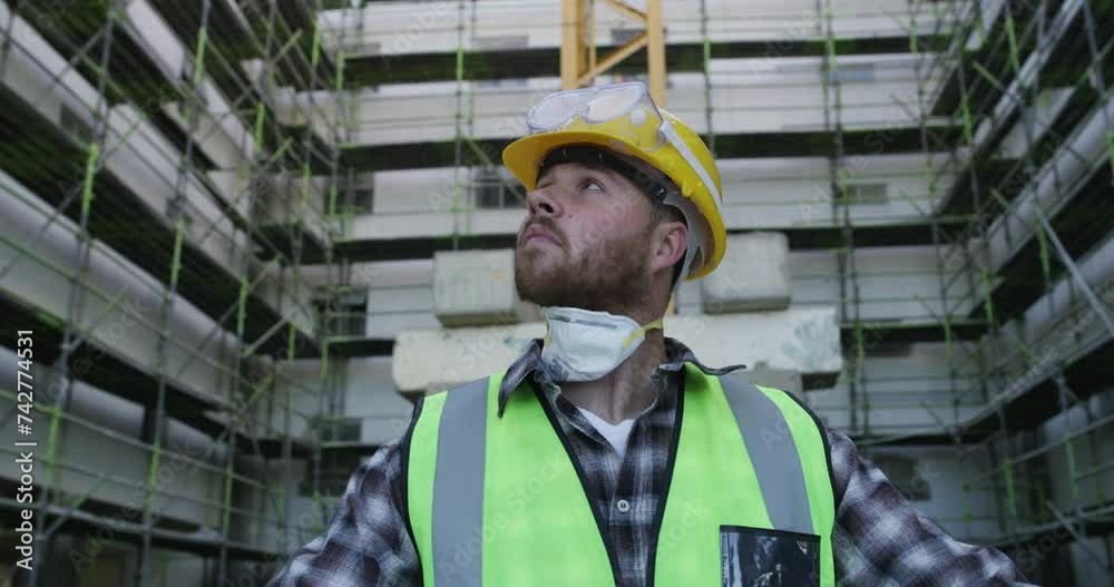 Poster Architect, man and blueprint at construction site in city, thinking and industrial development. Document, design and engineer with floor plan paper, building infrastructure and reading in low angle