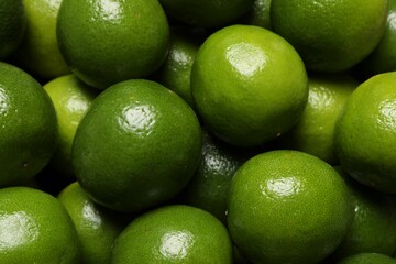 Many fresh ripe limes as background, top view