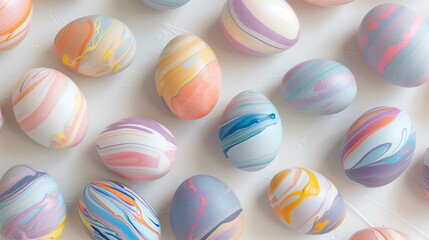 Fototapeta na wymiar array of marbled easter eggs with swirling pastel colors on a bright white background