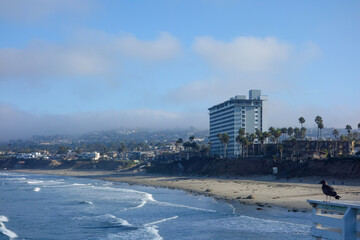 Early morning at Pacific Beach surrounded by seaside hotels and recreational areas as seen from Crystall Pier in San Diego, Southern California