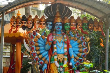 statue of god vishnu with multiple heads