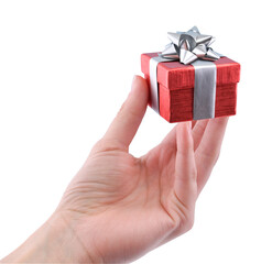 female hand holds a small red gift with silver bow isolated on transparent