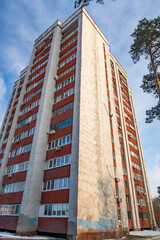 multi-storey residential building against the blue sky in winter