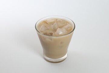 Iced coffee in glass on white background