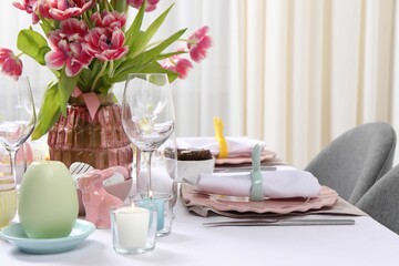 Festive table setting with beautiful flowers. Easter celebration