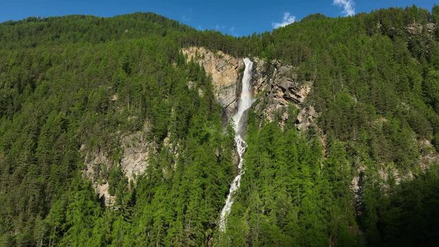 Lehner Wasserfall waterfall in the Otztal valley in Tyrol Austria during a beautiful springtime day in the Alps.