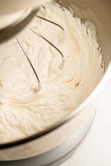 Whipping cream in a standard mixer with a whipping attachment