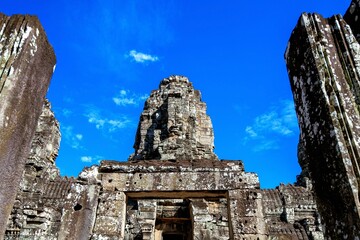 Naklejka premium Ancient Stone Faces Bayon Temple Angkor Wat Siam Reap Cambodia 2