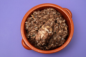 Typical portuguese dish chicken with rice in ceramic dish.