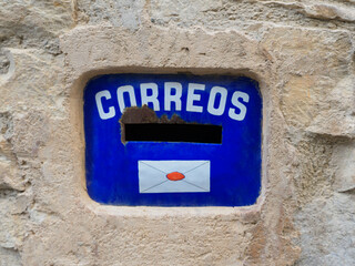 Mailbox embedded in stone wall. Spanish Mailbox