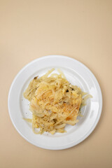 Traditional portuguese cousine, cod fish onions with oil.