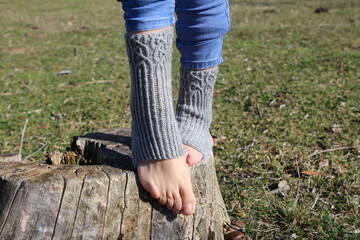 A person's feet in a puddle of water