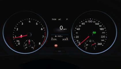 Inside the car. Speedometer scoring low speed on black background. Automobile