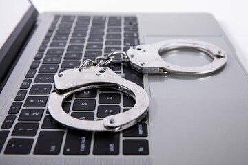 Closeup Shot Handcuffs Lying Laptop Keypad Online Crime Concept