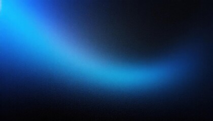 A gradient of blue light on a textured black background, abstract and atmospheric.