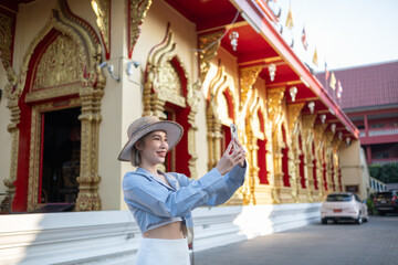Traveler Asian woman traveling and walking in Bangkok Chiang Mai Temple, Thailand, backpacker...