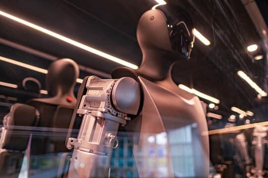 Tesla Bot Optimus robotic humanoid in showroom, Tesla AI Strategy: Elon Musk on FSD, innovative approach to engineering, Innovation in industry show in Berlin, Germany - February 17, 2024
