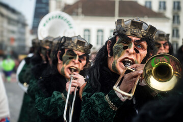 Basel - Switzerland - 21 February 2024 - portrait of masked people wearing traditional costume playing music parading in the street
- 742890566