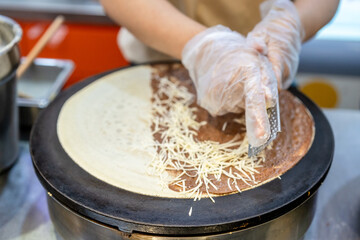 Making chocolate and cheese crepes