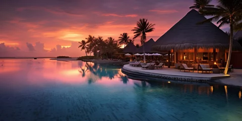 Keuken spatwand met foto Maldives at a resort on the island at sunset. © Wararat