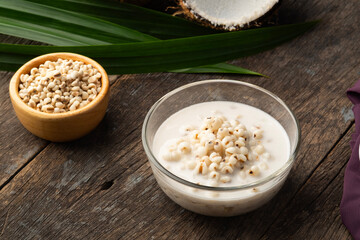 Job's tears in Sweet Coconut Milk,Boiled millet with coconut soup in glass bowl.