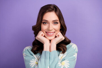 Fototapeta premium Photo of adorable dreamy lady dressed flower print cardigan arms cheeks smiling isolated violet color background