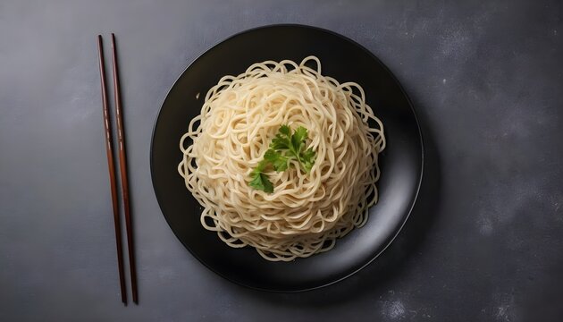 dry and raw flour noodles on a black plate. View from above. Chinese cuisine
