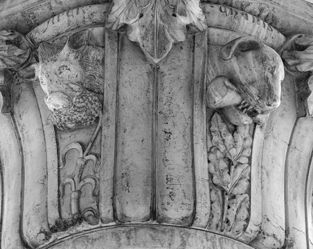Venice, Italy, Sept. 17, 2023: A boar, and a dog with sharp fangs grasping a bone, are among the many medieval animal carvings found on the Doge’s Palace portico columns. 