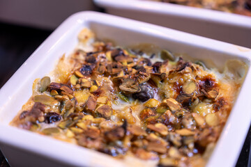 um ali is arabic sweet that made of puff pastry and nuts with milk and cream also you can add some honey as topping