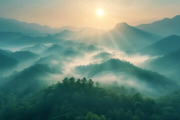 Aerial view of mountains covered in fog with sun rising behind a fog covered forest - obrazy, fototapety, plakaty