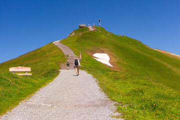 Hiking trail to summit of mountain Mannlichen with popular viewpoint in Swiss Alps, Switzerland.