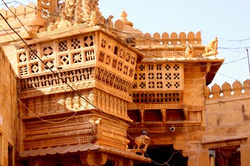 Floral-style Rajasthani haveli carving patterns adorn an old building in Jaisalmer, Rajasthan, India