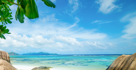Blue sky over the coral reef of a tropical beach. Seychelles, Indian Ocean - 742960131