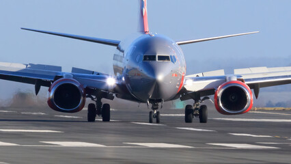 Fototapeta na wymiar Closeup of taxiing G-JZBL after Just landing at EMA