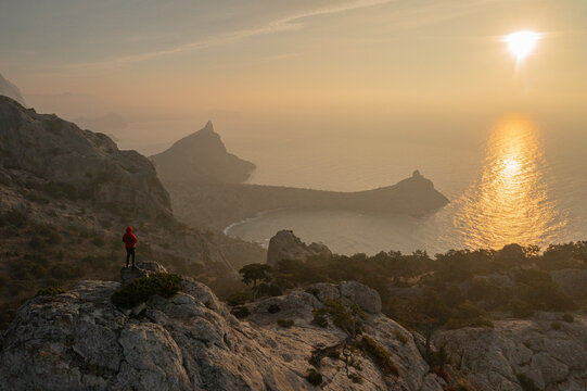 View of a person overlooking the coastline facing the Black Sea, Autonomous Republic of Crimea, Ukraine.
