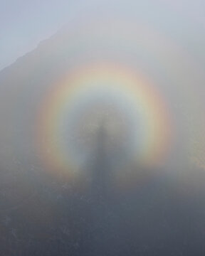 View of circular rainbow with silhouette in the middle, taken from Pico Ruivo mountain at Madeira island, Portugal