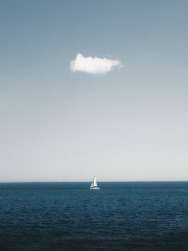 View of a boat floating underneath a cloud, Acadia National Park, Maine, United States.