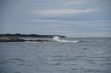 New England lighthouse and seascape ocean landscape nature view in Portland, Maine bay with horizon scenic coastal scenery