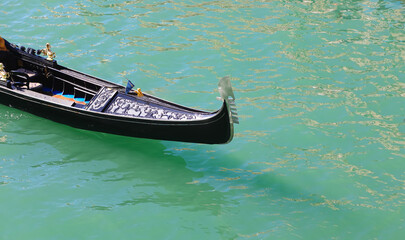 bow of the Gondola the typical boat for transporting tourists in Venice in Italy on the water of the Grand Canal