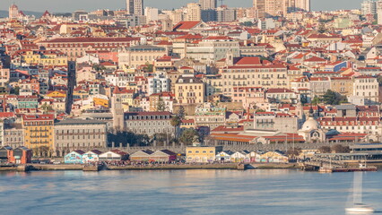 Aerial view of crowd on waterfront near Cais Do Sodre ferry terminal on Tejo river timelapse in Lisbon, Portugal