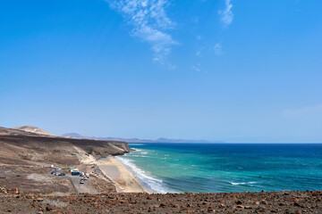 The Atlantic Ocean and Sotavento beach with clear sky and mountains in back