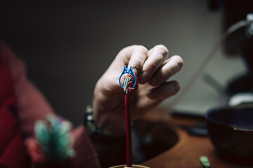 Making wax tree jewelry befor casting,process of making jewelry. Close up photo of hand and...