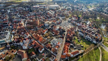 Aerial around the old town of Bad Hersfeld in Germany on a sunny morning in autumn