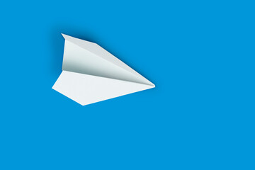 Paper plane concept. Mockup design with airplane on blue background with blank empty space for copy space.