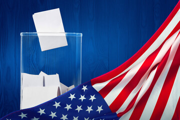 A ballot box with ballots on Election Day, flag USA