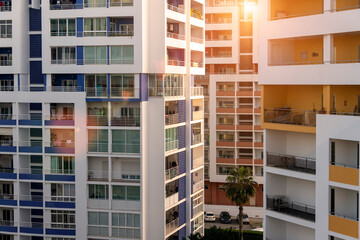 Modern buildings of residential flats, sun flare.