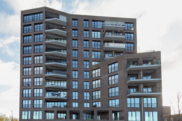 Modern high-rise apartments with balconies in the new IJburg district in Amsterdam. - obrazy, fototapety, plakaty