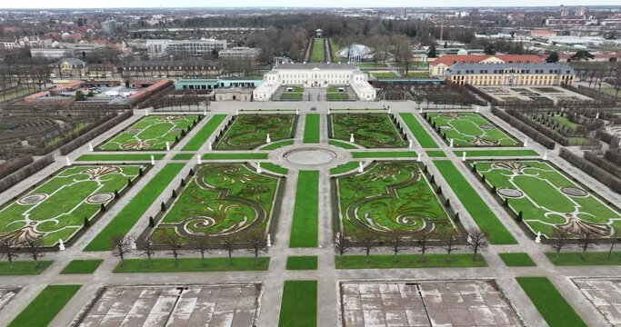 Touristic baroque herrenhauser gardens in Hannover, Germany. City park, flora and fauna in the city. Green city, touristic attraction and landmark. Birds eye aerial drone view.