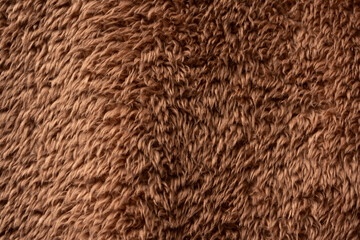 Texture of a brown faux fur as a background.
